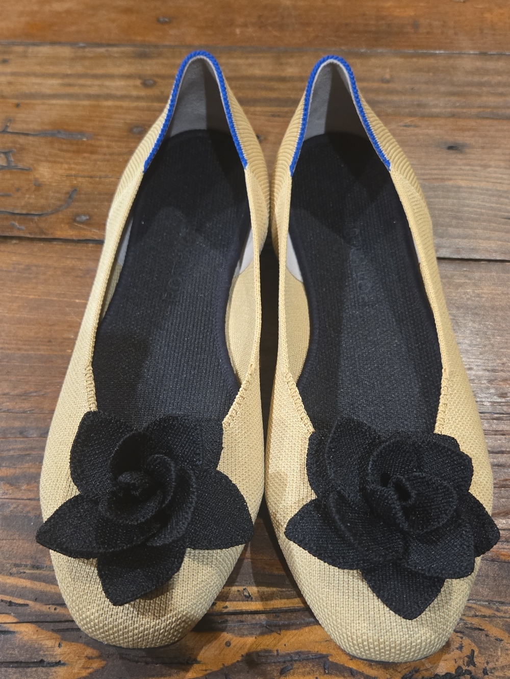 Rothy's Beige Flats with Black Floral Accent and Blue Trim